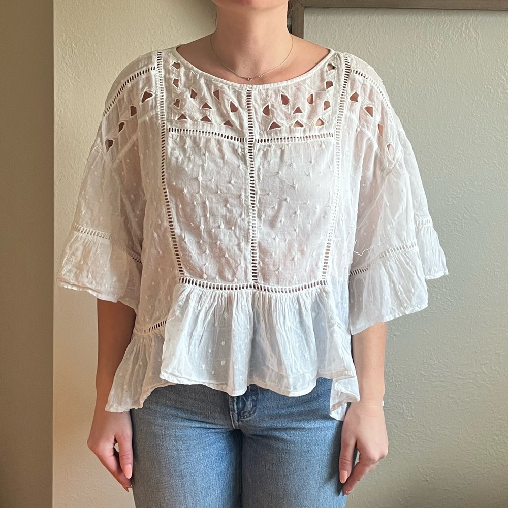 White Free People crop top with ruffles and cutouts